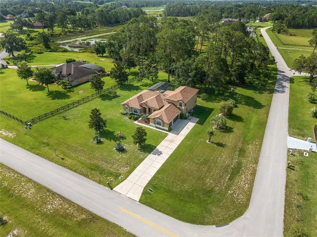 a backyard of a house with lots of green space