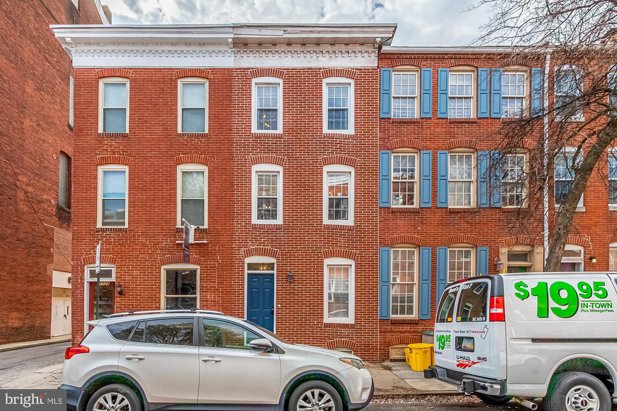 1122 William Street, Unit B Baltimore, MD 21230 - Photo 1 of 31 a front view of a house with parking space