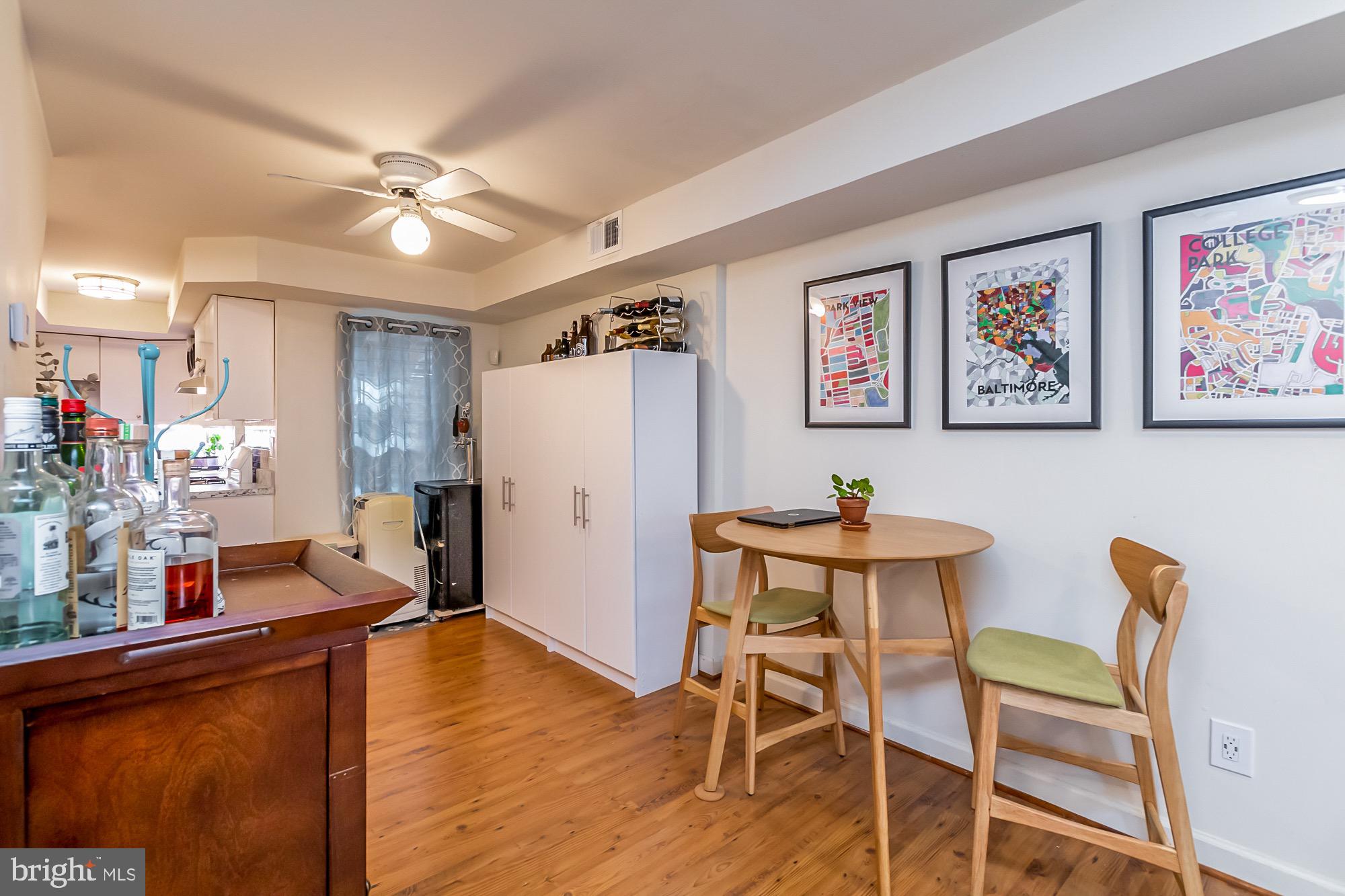 1122 William Street, Unit B Baltimore, MD 21230 - Photo 16 of 31 a view of a dining room with furniture and wooden floor