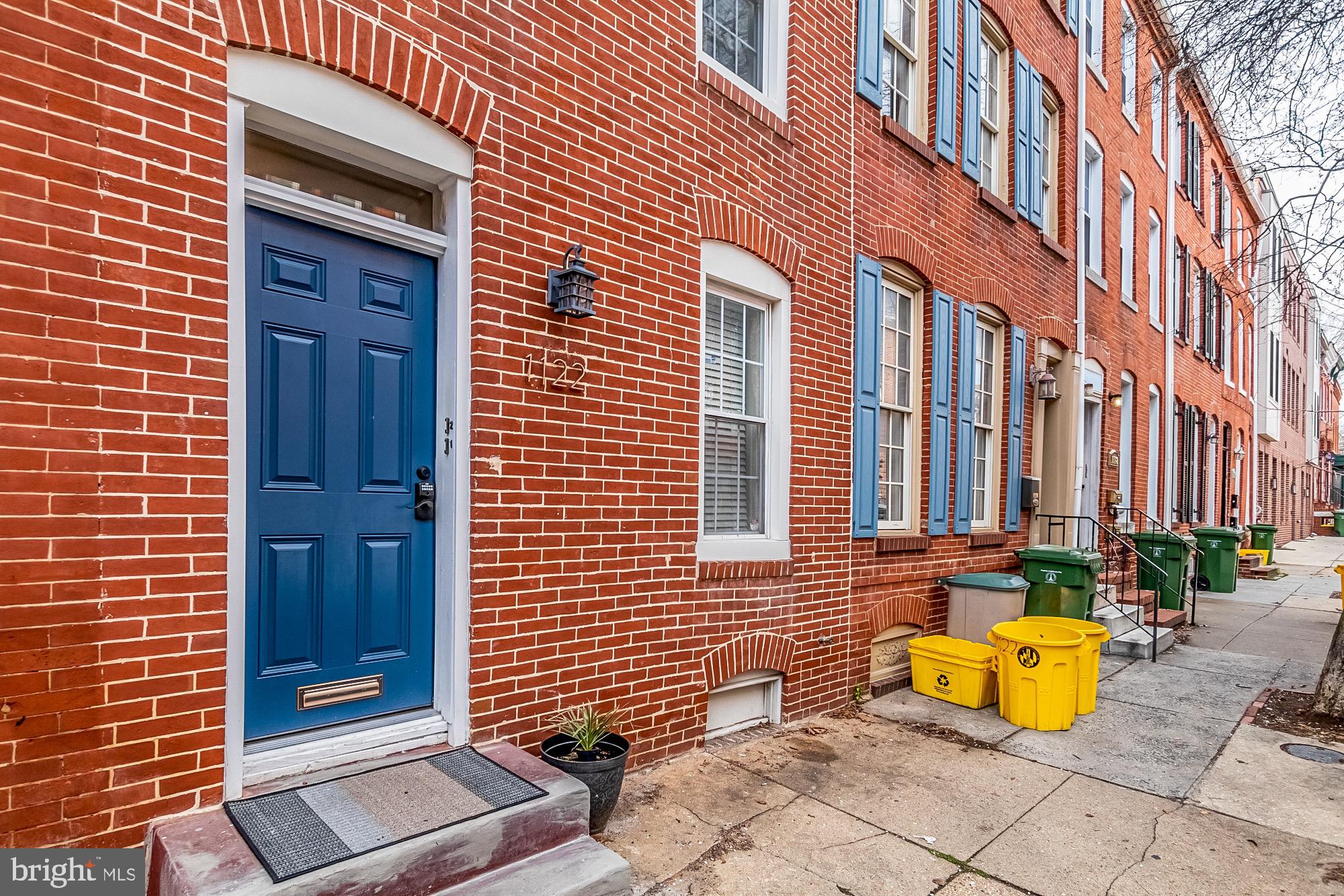 1122 William Street, Unit B Baltimore, MD 21230 - Photo 2 of 31 a view of a brick building with many windows