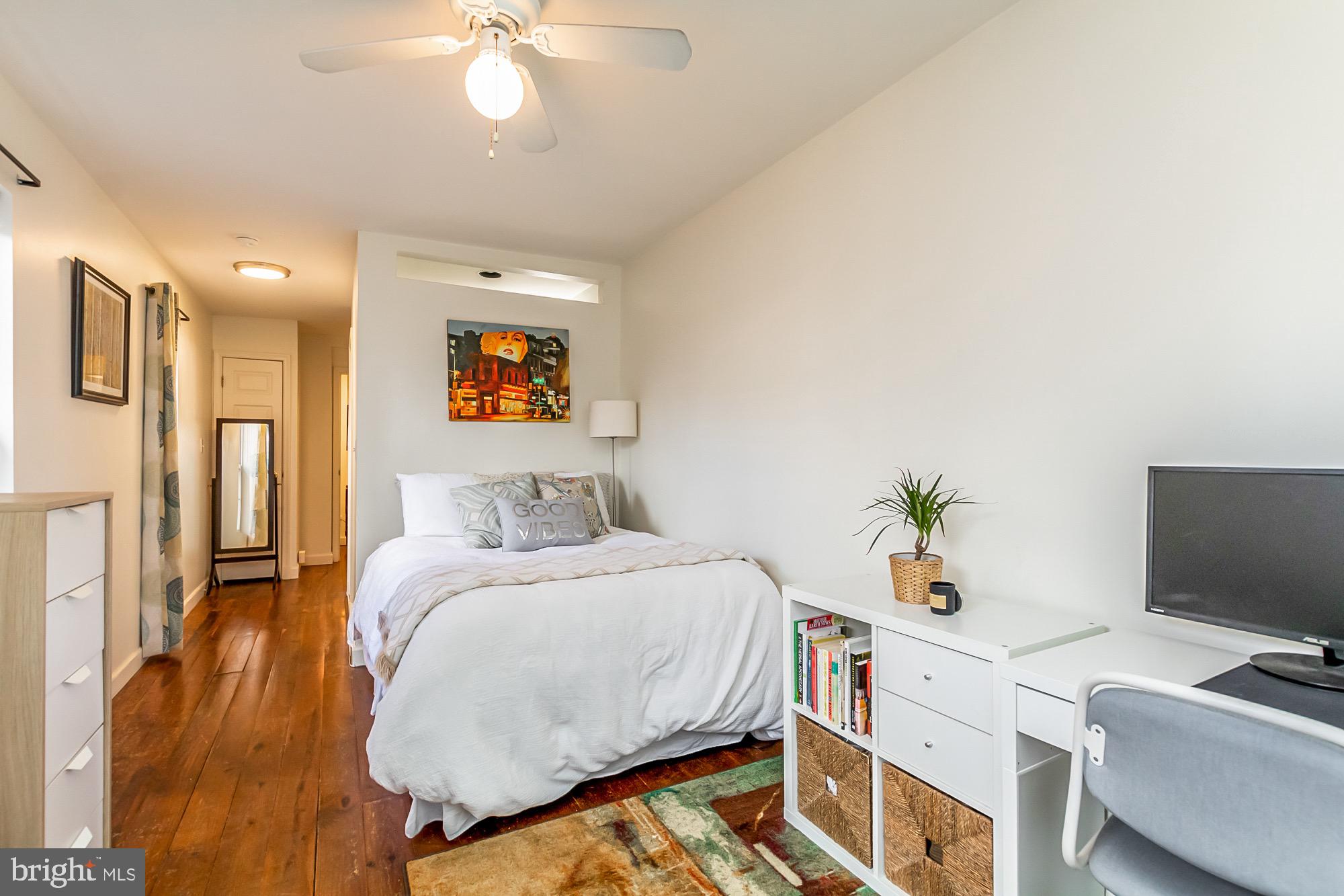 1122 William Street, Unit B Baltimore, MD 21230 - Photo 21 of 31 a bedroom with a bed and a tv