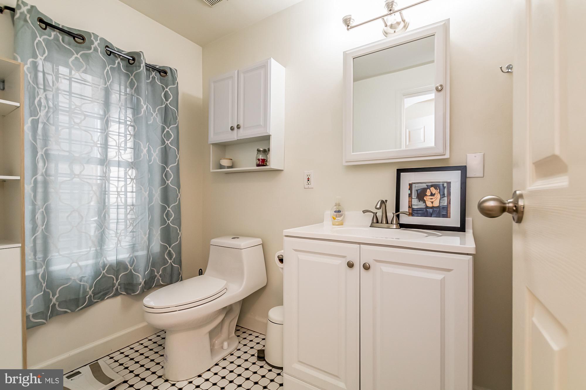 1122 William Street, Unit B Baltimore, MD 21230 - Photo 24 of 31 a bathroom with a toilet sink and shower