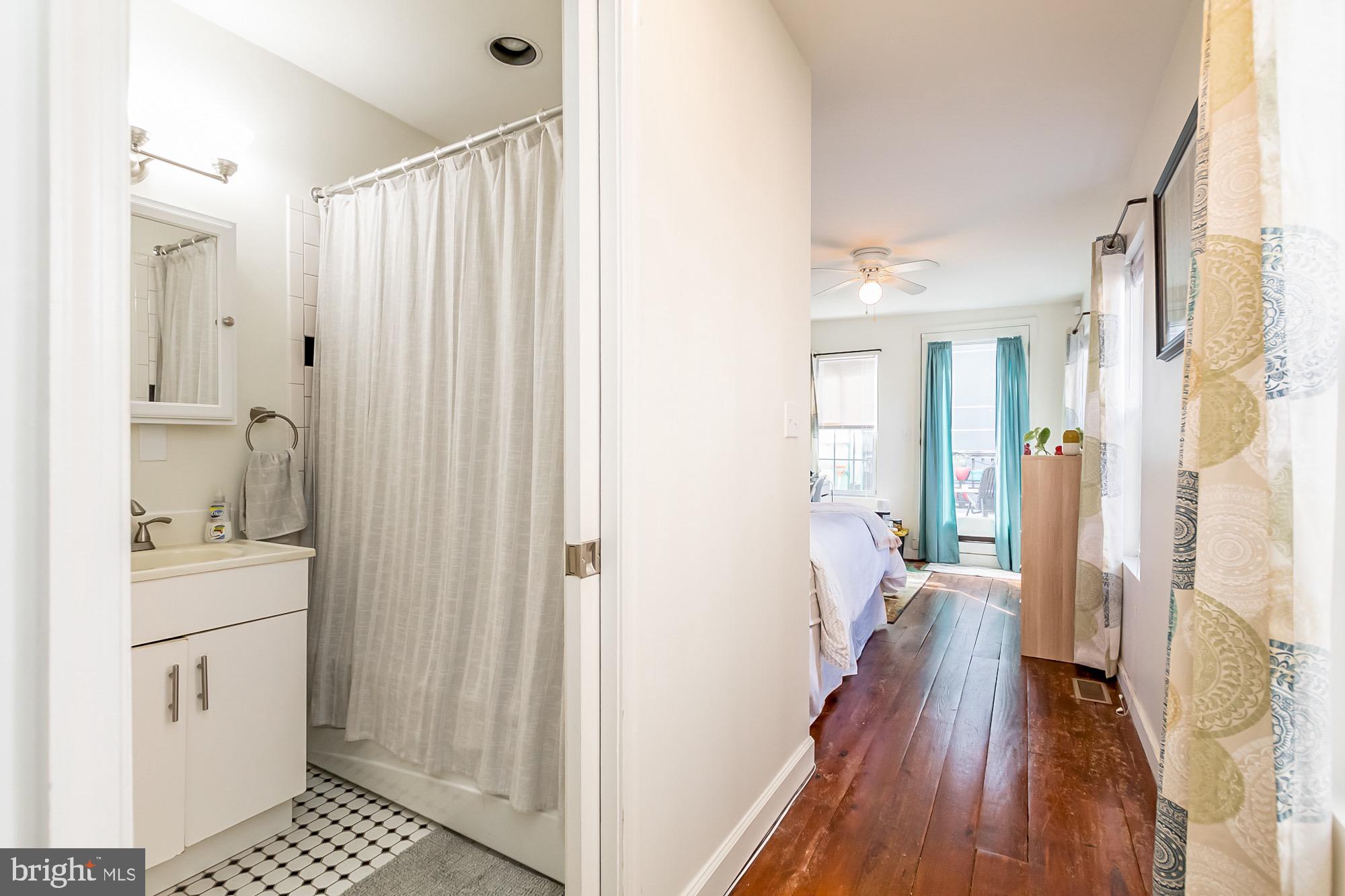 1122 William Street, Unit B Baltimore, MD 21230 - Photo 26 of 31 a bathroom with a sink and a mirror