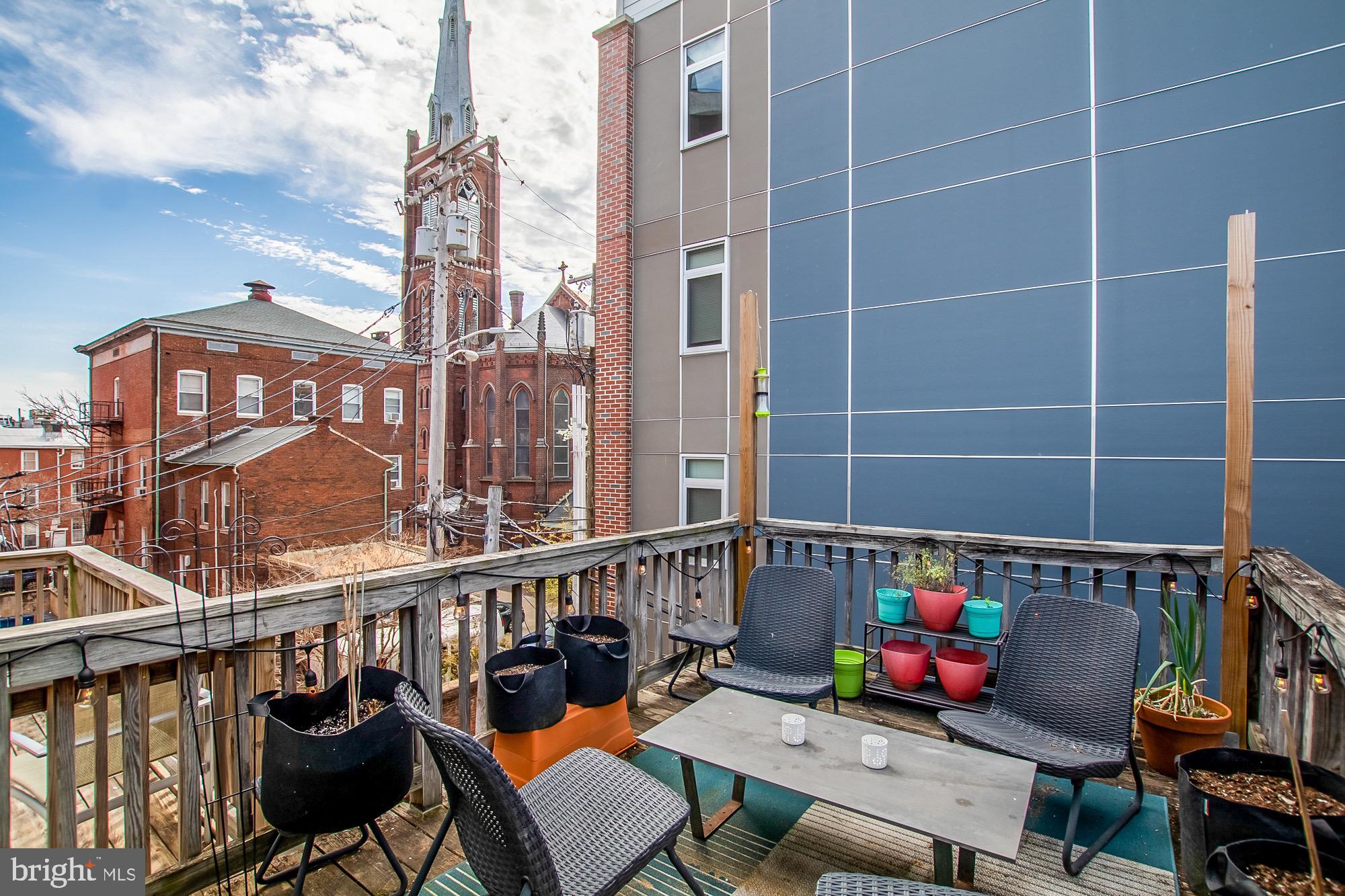 1122 William Street, Unit B Baltimore, MD 21230 - Photo 28 of 31 a view of a balcony with chairs