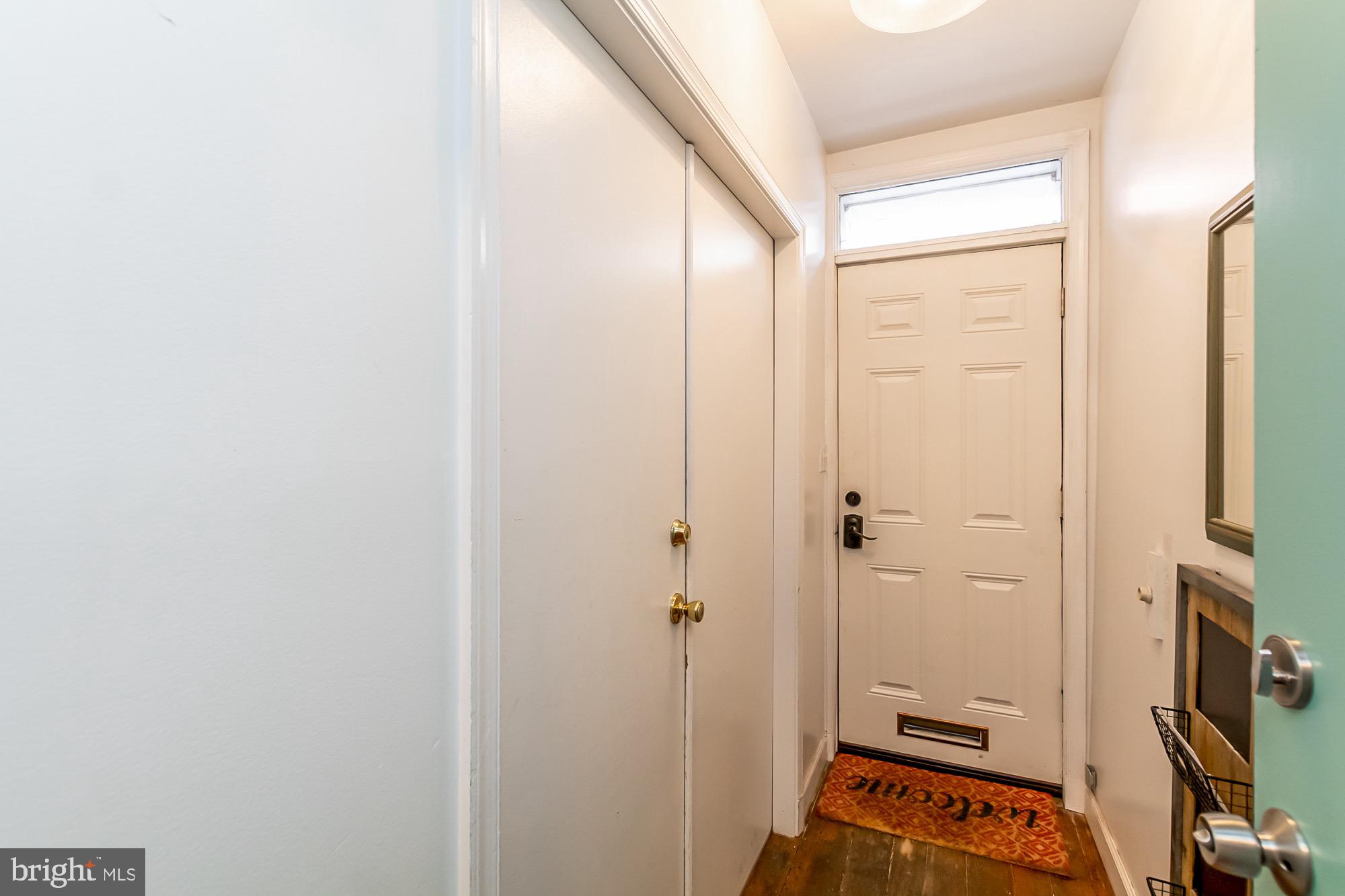 1122 William Street, Unit B Baltimore, MD 21230 - Photo 5 of 31 a area with closet and a mirror