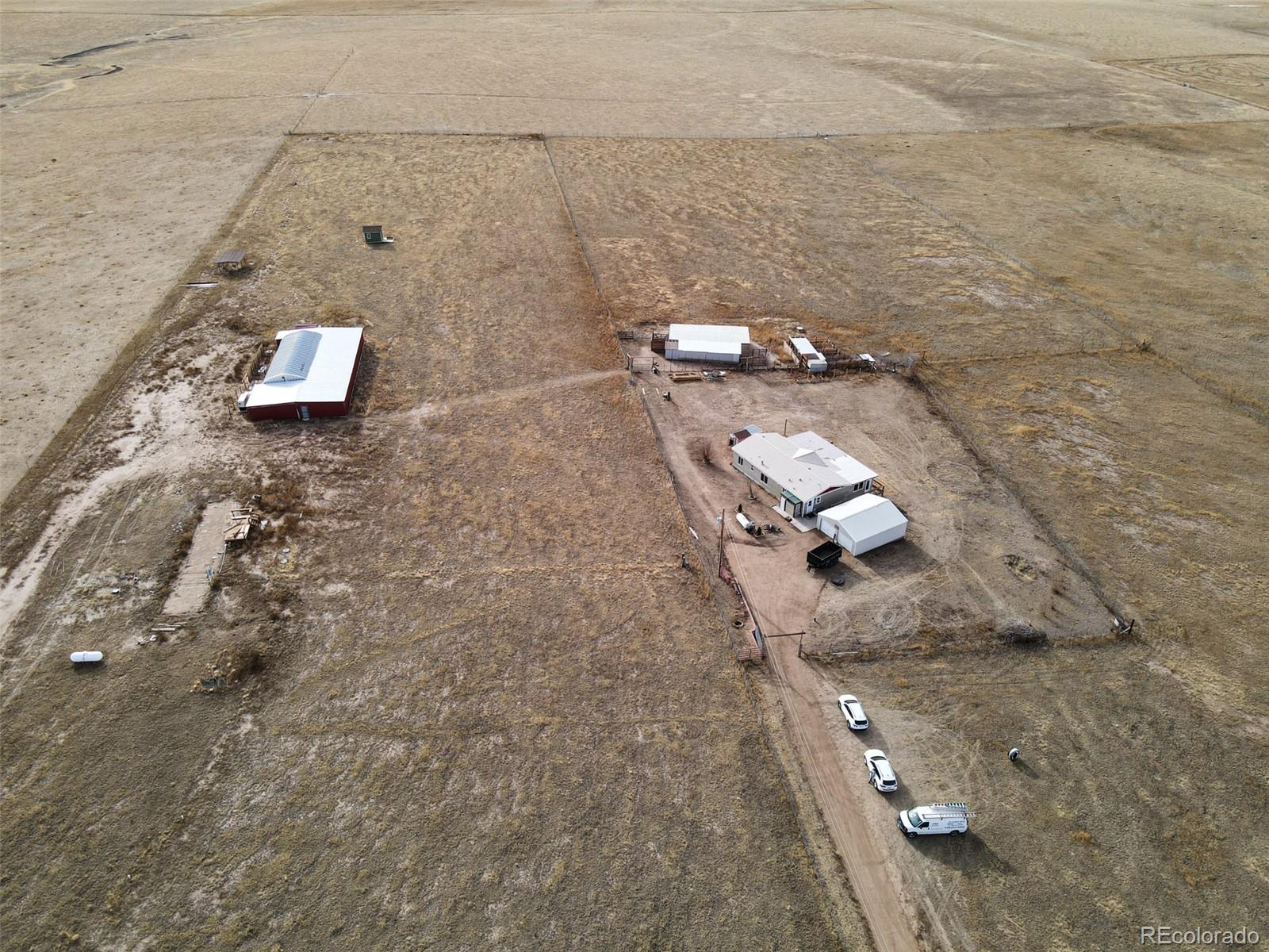 31475 Big Springs Road Calhan, CO 80808 - Photo 6 of 14 an aerial view of a house with a yard