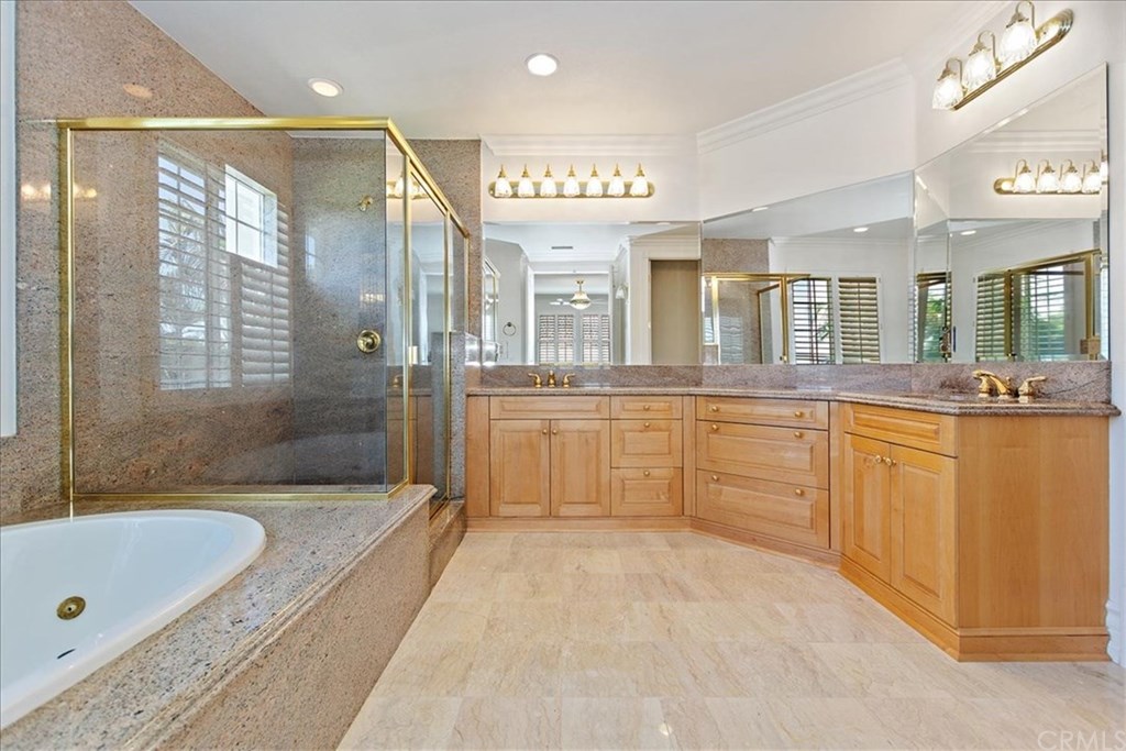 2432 Prospect Drive Upland, CA 91784 - Photo 18 of 46 a large bathroom with a large tub sink shower and mirror