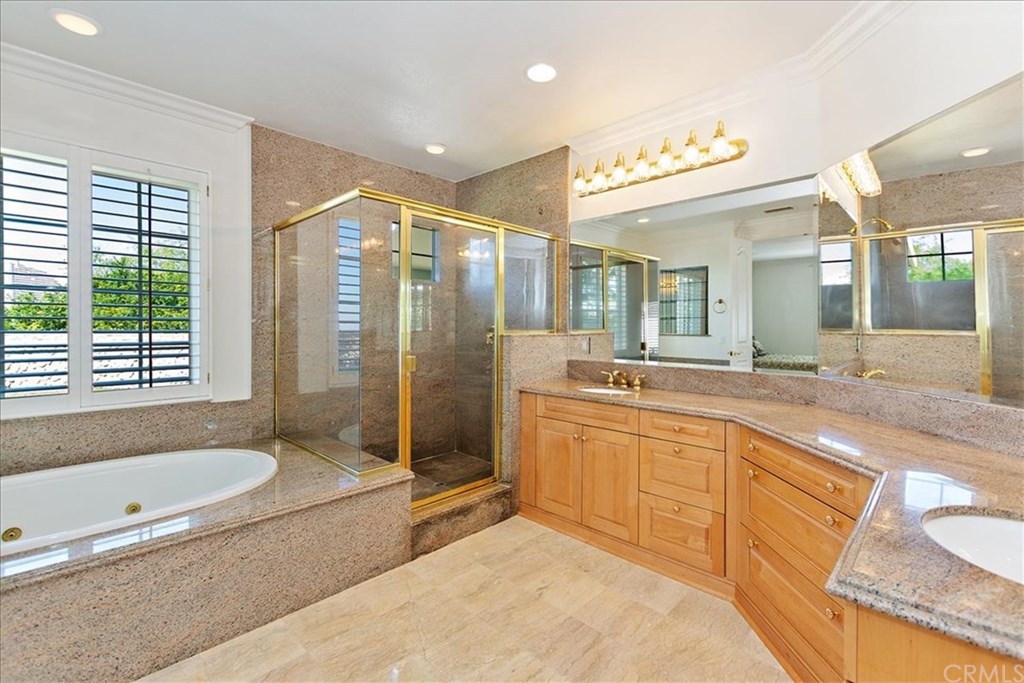 2432 Prospect Drive Upland, CA 91784 - Photo 19 of 46 a spacious bathroom with a tub sink shower and mirror