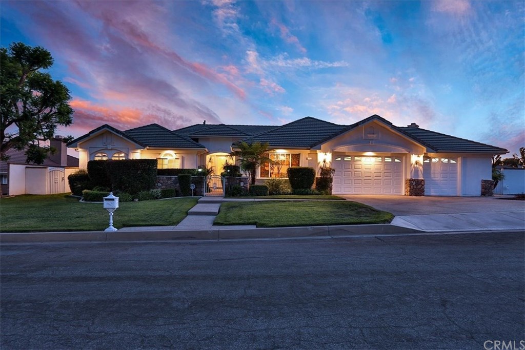 2432 Prospect Drive Upland, CA 91784 - Photo 2 of 46 a front view of a house with a yard and garage
