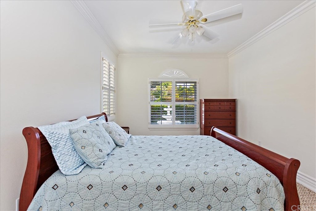 2432 Prospect Drive Upland, CA 91784 - Photo 24 of 46 a bedroom with a bed and a chandelier