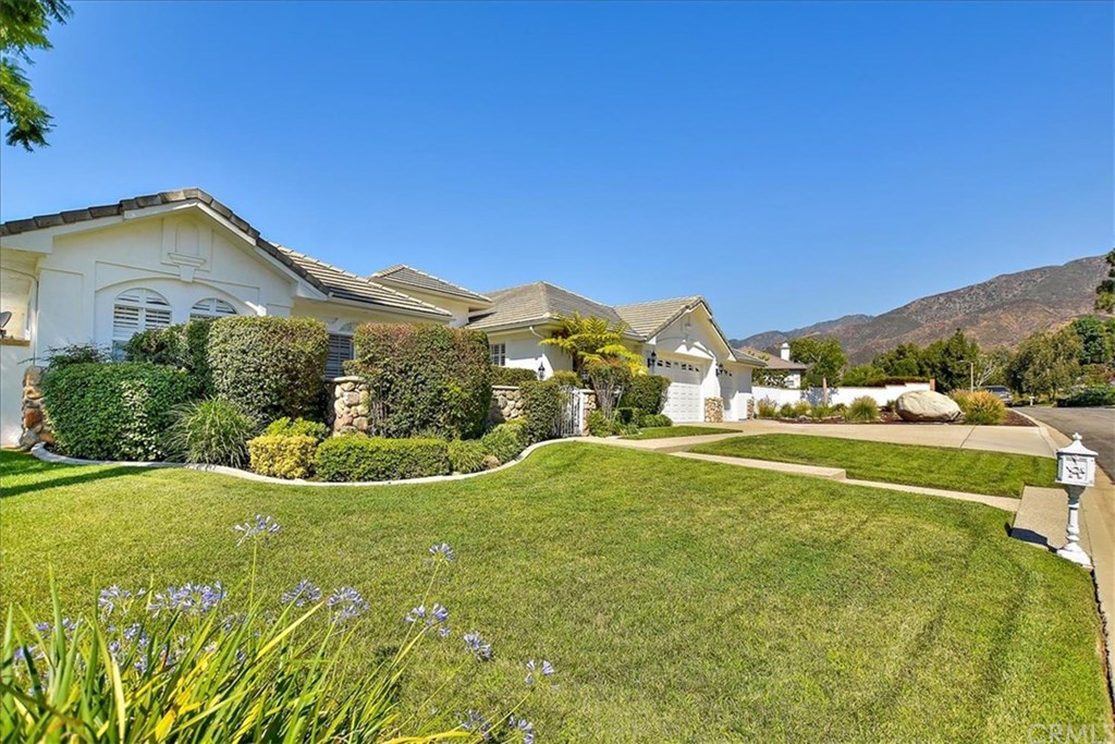 2432 Prospect Drive Upland, CA 91784 - Photo 34 of 46 a view of a house with a big yard and potted plants