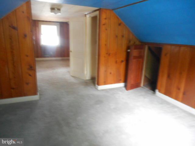 6313 Fieldvale Road Baltimore, MD 21237 - Photo 18 of 30 a view of an empty room with wooden floor and a window
