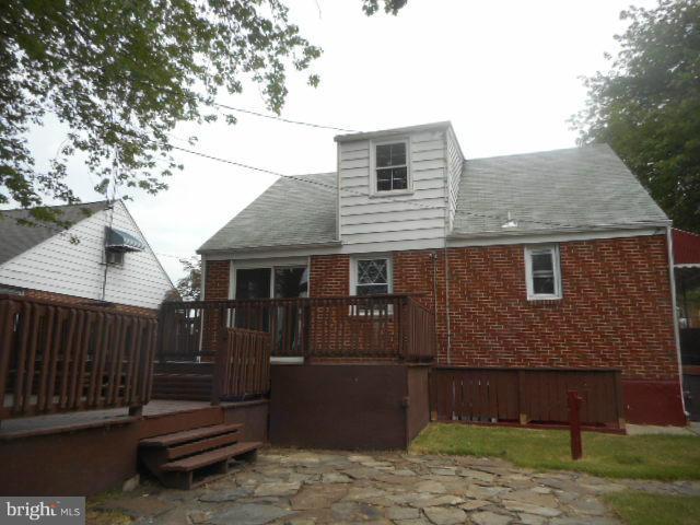 6313 Fieldvale Road Baltimore, MD 21237 - Photo 29 of 30 a front view of a house with a yard