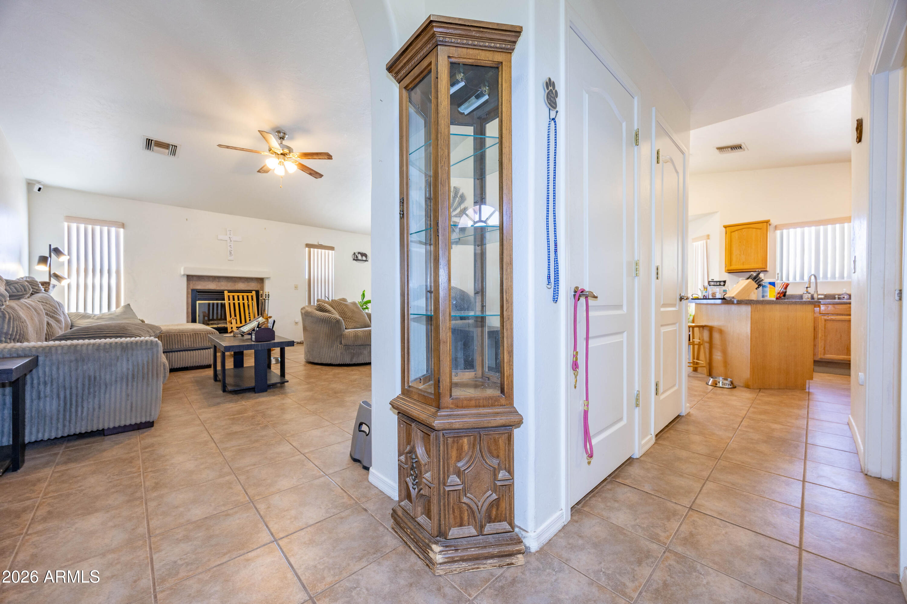 4575 South Kino Road Sierra Vista, AZ 85650 - Photo 12 of 25 a living room with furniture and a chandelier