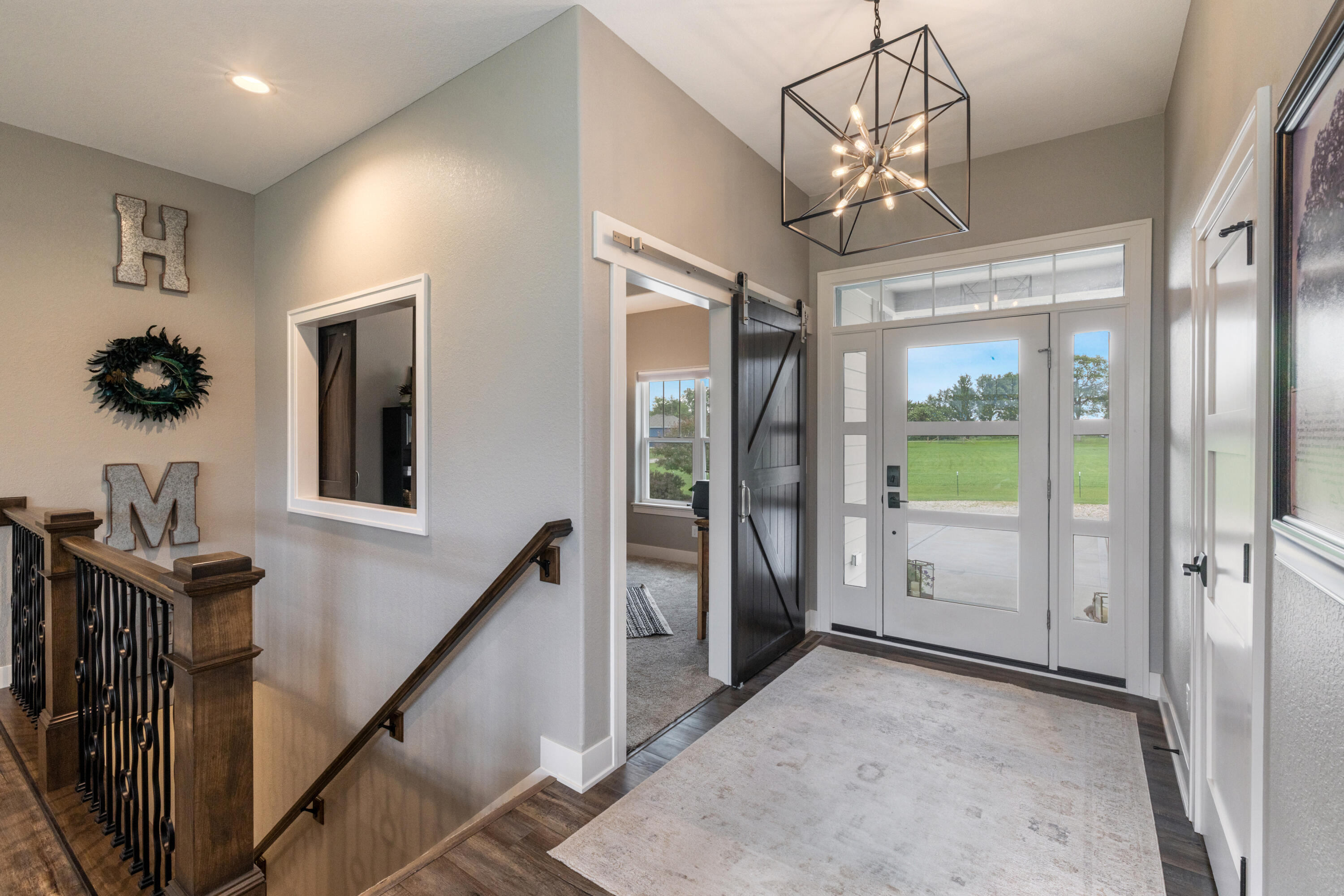 S75W35724 Wilton Road Eagle, WI 53119 - Photo 8 of 63 A bright, grand entry with staircase to lower level for a cohesive feel to the entire home