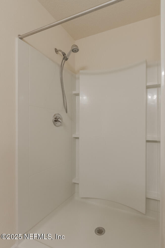 97 Coastline Way Street St. Augustine, FL 32092 - Photo 12 of 31 a bathroom with a shower