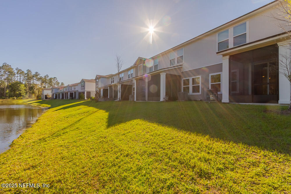 97 Coastline Way Street St. Augustine, FL 32092 - Photo 20 of 31 a view of a swimming pool with an outdoor space and seating area