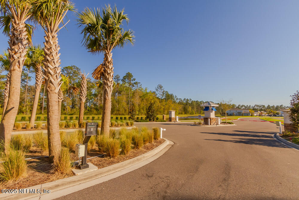 97 Coastline Way Street St. Augustine, FL 32092 - Photo 24 of 31 a view of a swimming pool with a terrace