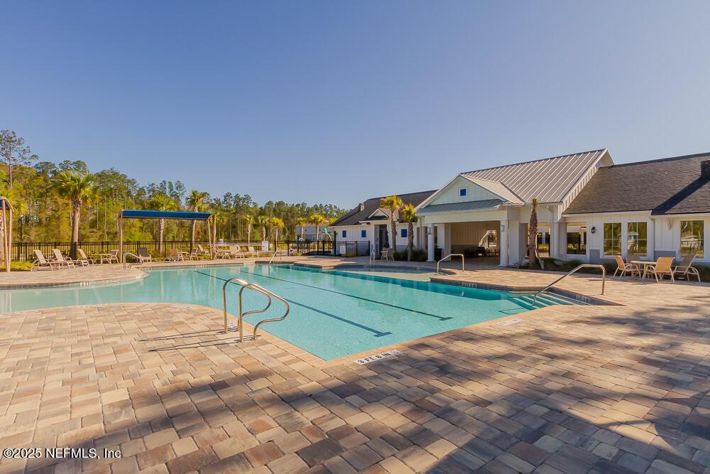 97 Coastline Way Street St. Augustine, FL 32092 - Photo 27 of 31 a view of house with outdoor space and seating area