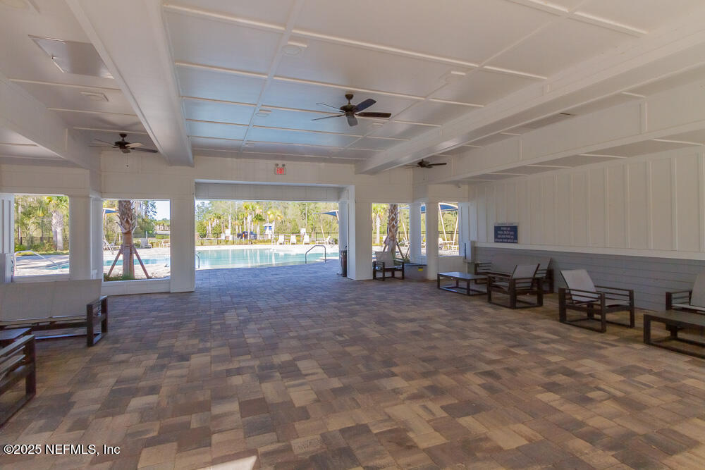 97 Coastline Way Street St. Augustine, FL 32092 - Photo 28 of 31 a room with furniture and a large window
