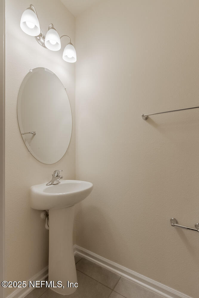 97 Coastline Way Street St. Augustine, FL 32092 - Photo 5 of 31 a bathroom with a sink mirror and toilet