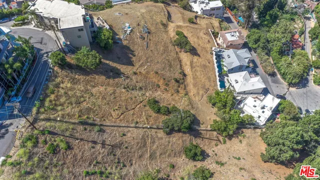 a view of a house with a tree