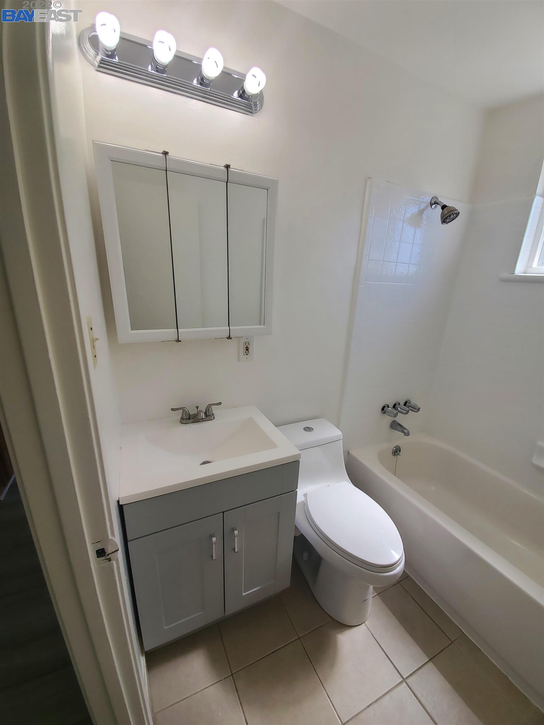 1869 E Street Hayward, CA 94541 - Photo 12 of 22 a bathroom with a sink a toilet and bathtub