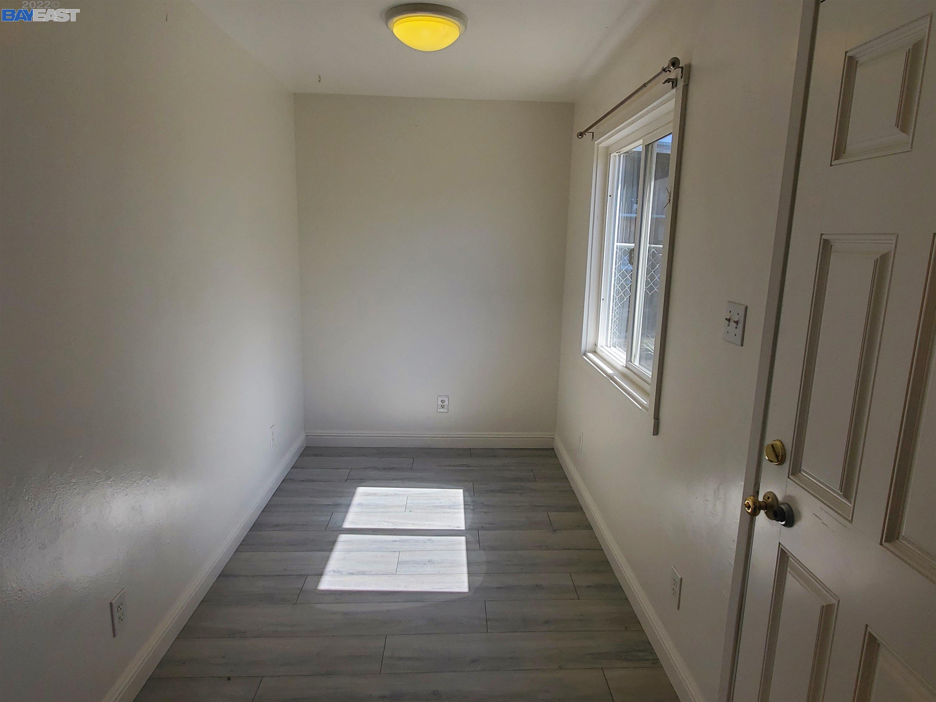1869 E Street Hayward, CA 94541 - Photo 17 of 22 a view of a hallway with wooden floor