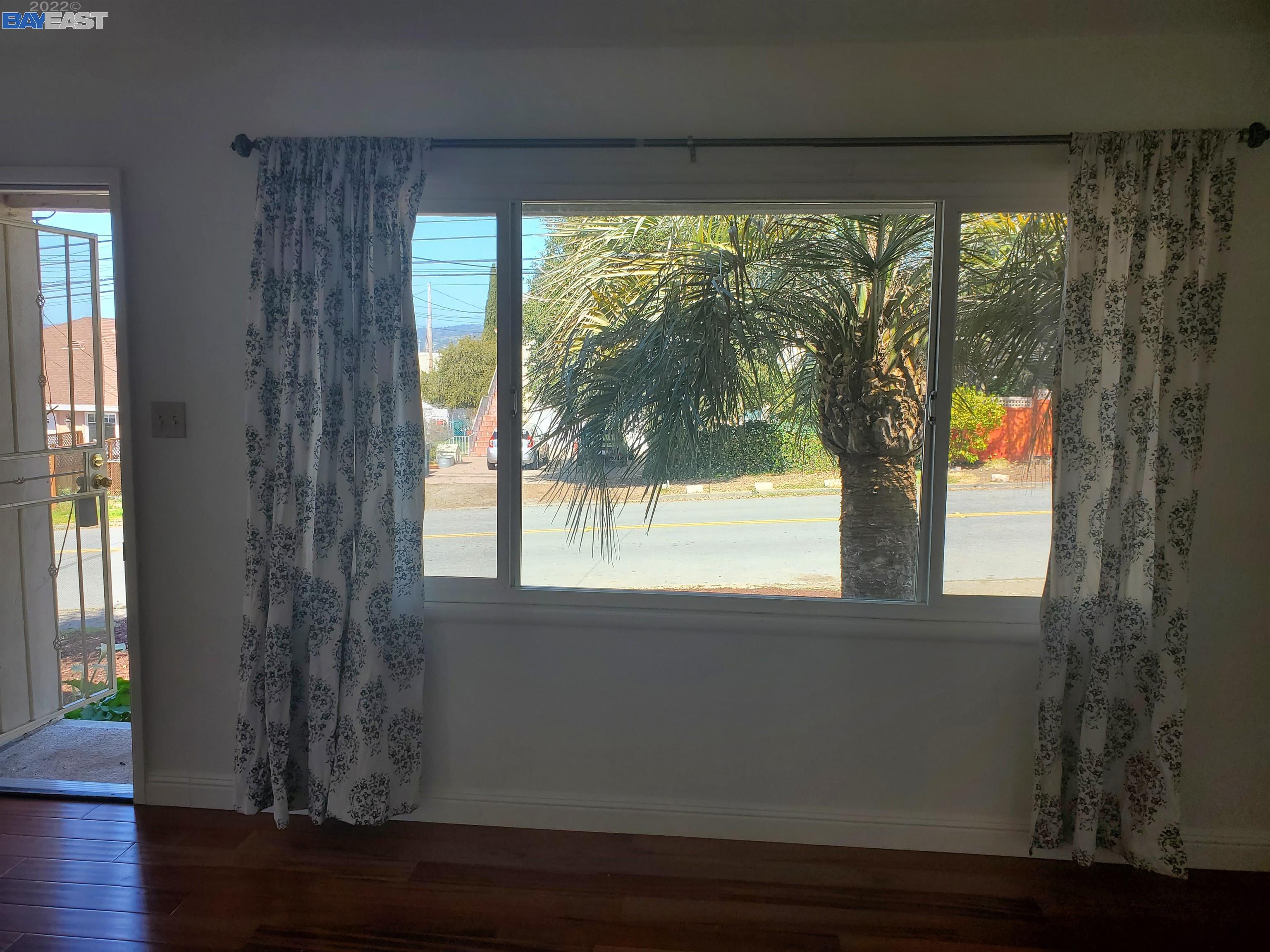 1869 E Street Hayward, CA 94541 - Photo 4 of 22 a view of empty room with wooden floor and fan