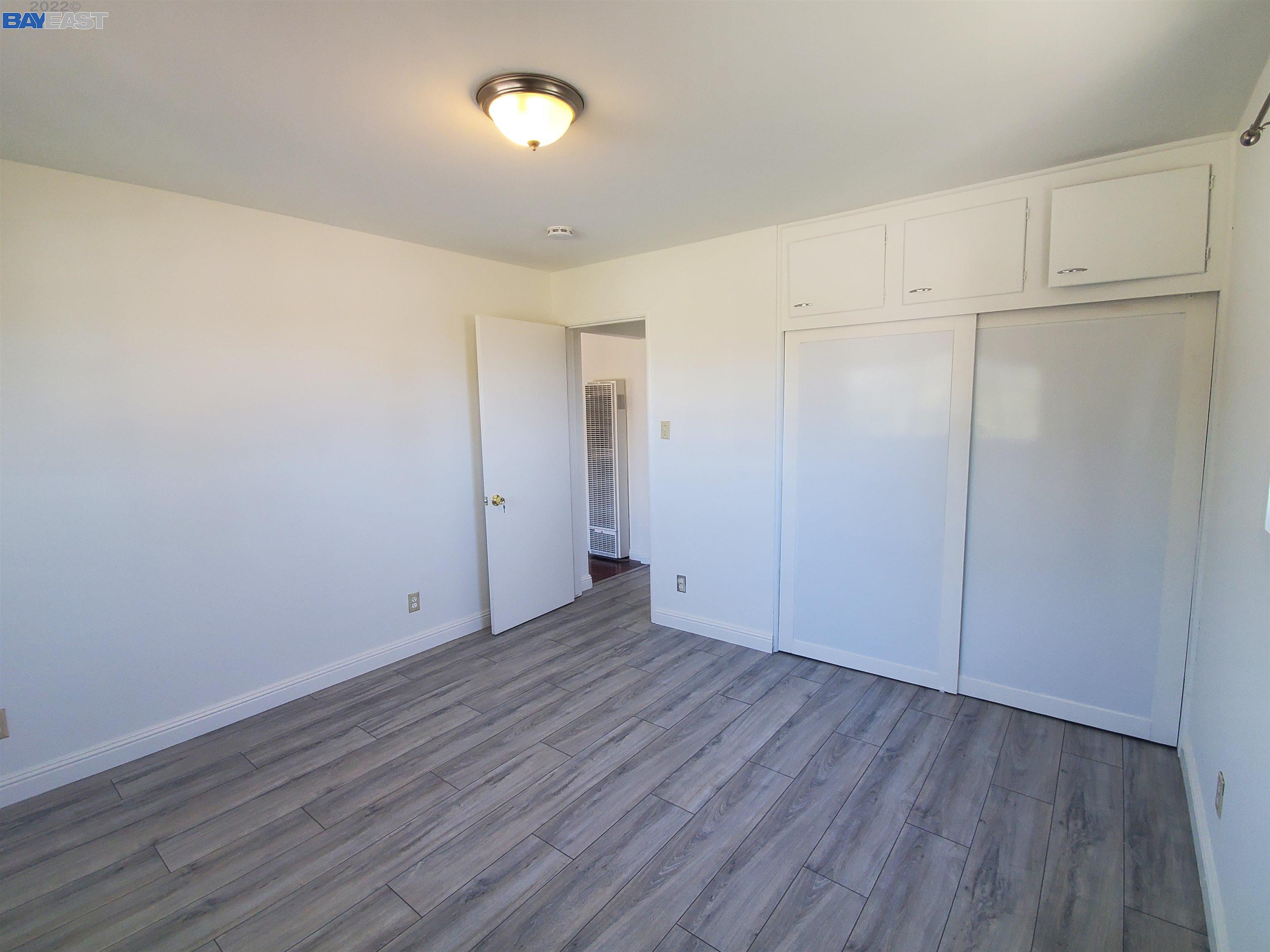 1869 E Street Hayward, CA 94541 - Photo 6 of 22 an empty room with wooden floor