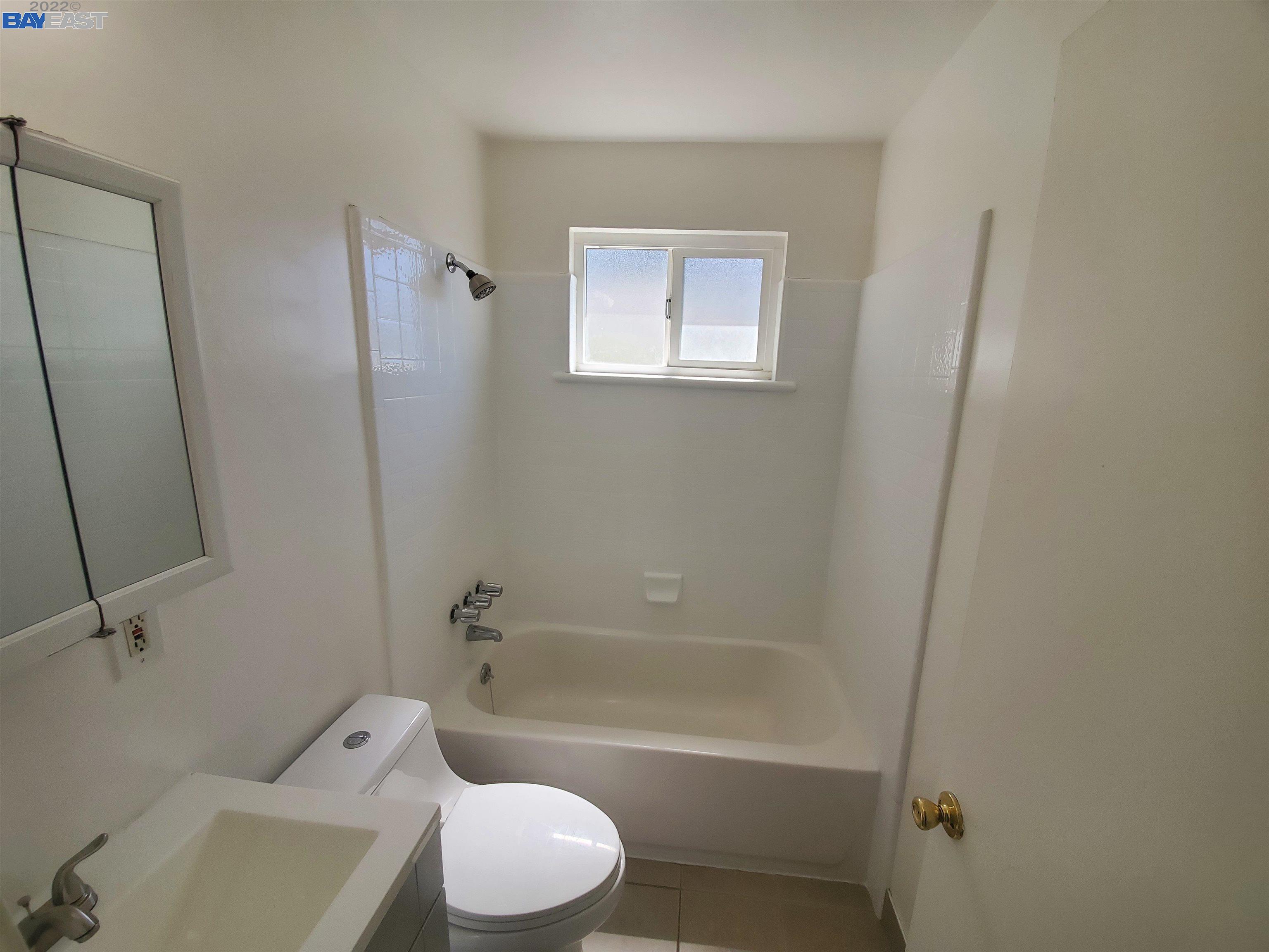 1869 E Street Hayward, CA 94541 - Photo 10 of 22 a bathroom with a toilet and a tub