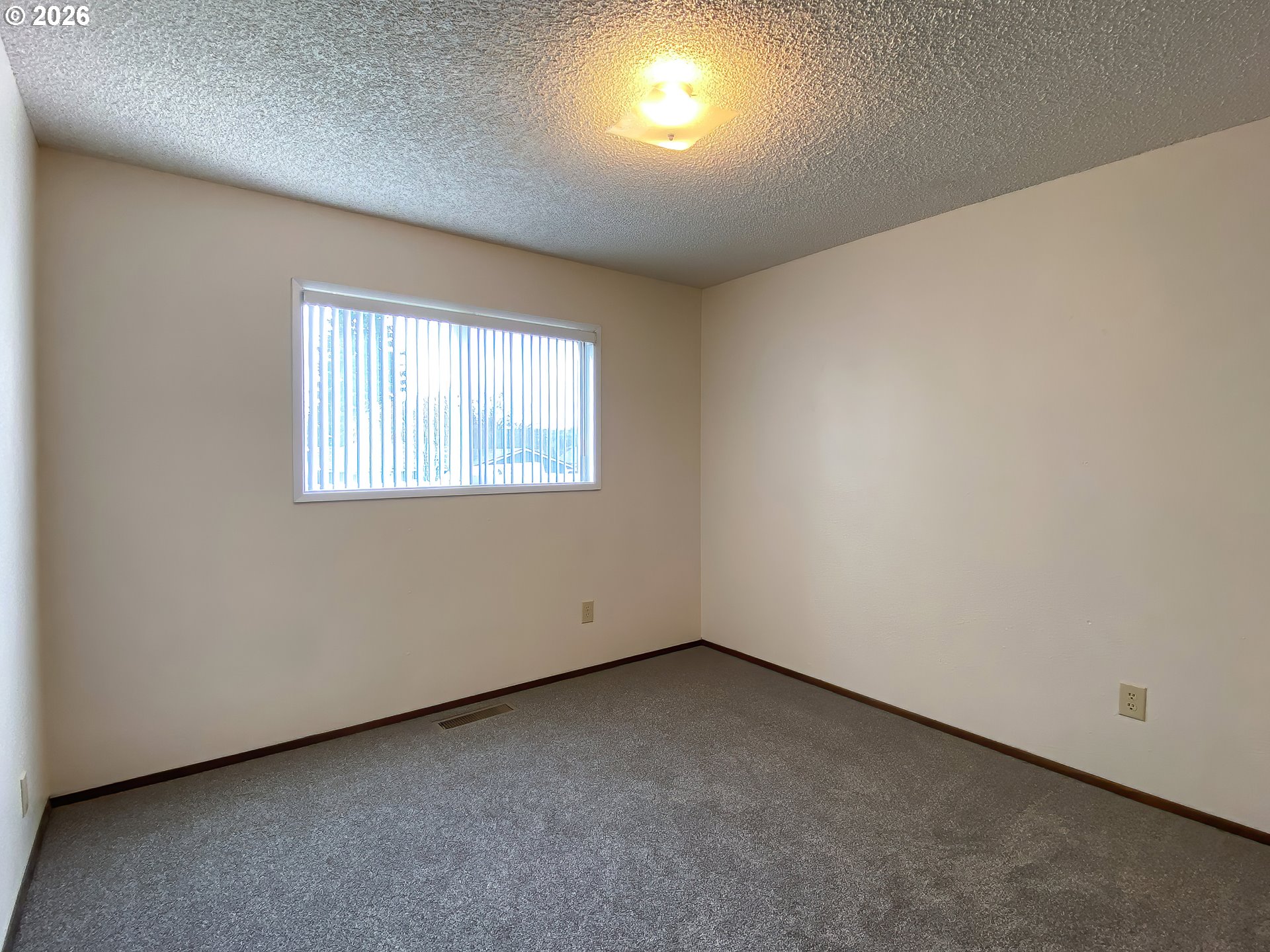 710 Northeast 5th Street Willamina, OR 97396 - Photo 12 of 18 an empty room with a window