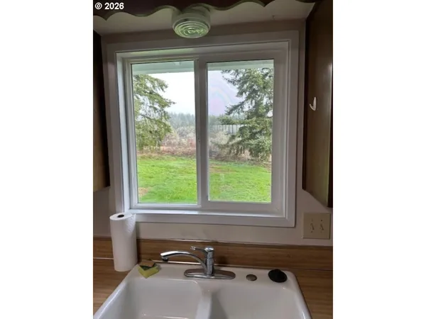 a bathroom with a sink and a window