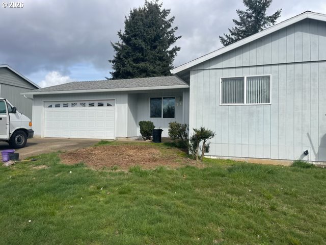 710 Northeast 5th Street Willamina, OR 97396 - Photo 7 of 18 a backyard of a house with table and chairs