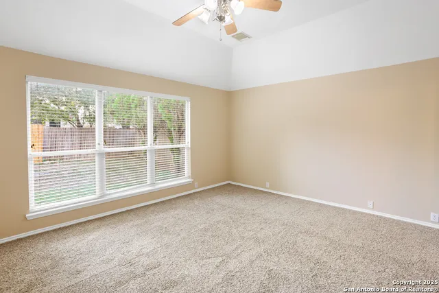 a view of a livingroom with a chandelier fan