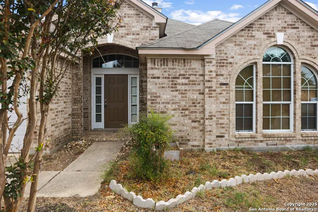an empty room with wooden floor and cabinet