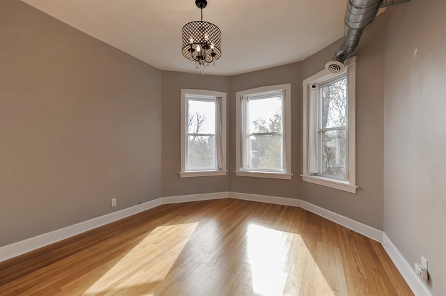 2012 West Haddon Avenue, Unit 3 Chicago, IL 60622 - Photo 3 of 12 wooden floor in an empty room with a window