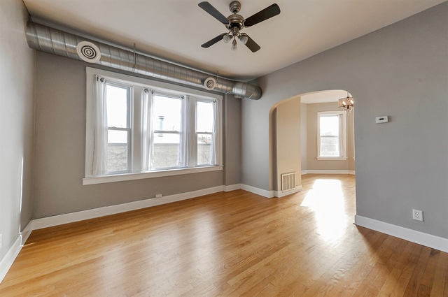 2012 West Haddon Avenue, Unit 3 Chicago, IL 60622 - Photo 5 of 12 a view of empty room with wooden floor and fan