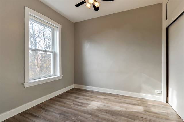 2012 West Haddon Avenue, Unit 3 Chicago, IL 60622 - Photo 8 of 12 a view of an empty room with window and wooden floor