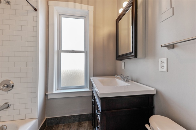 2012 West Haddon Avenue, Unit 3 Chicago, IL 60622 - Photo 9 of 12 a bathroom with a sink a mirror and a toilet