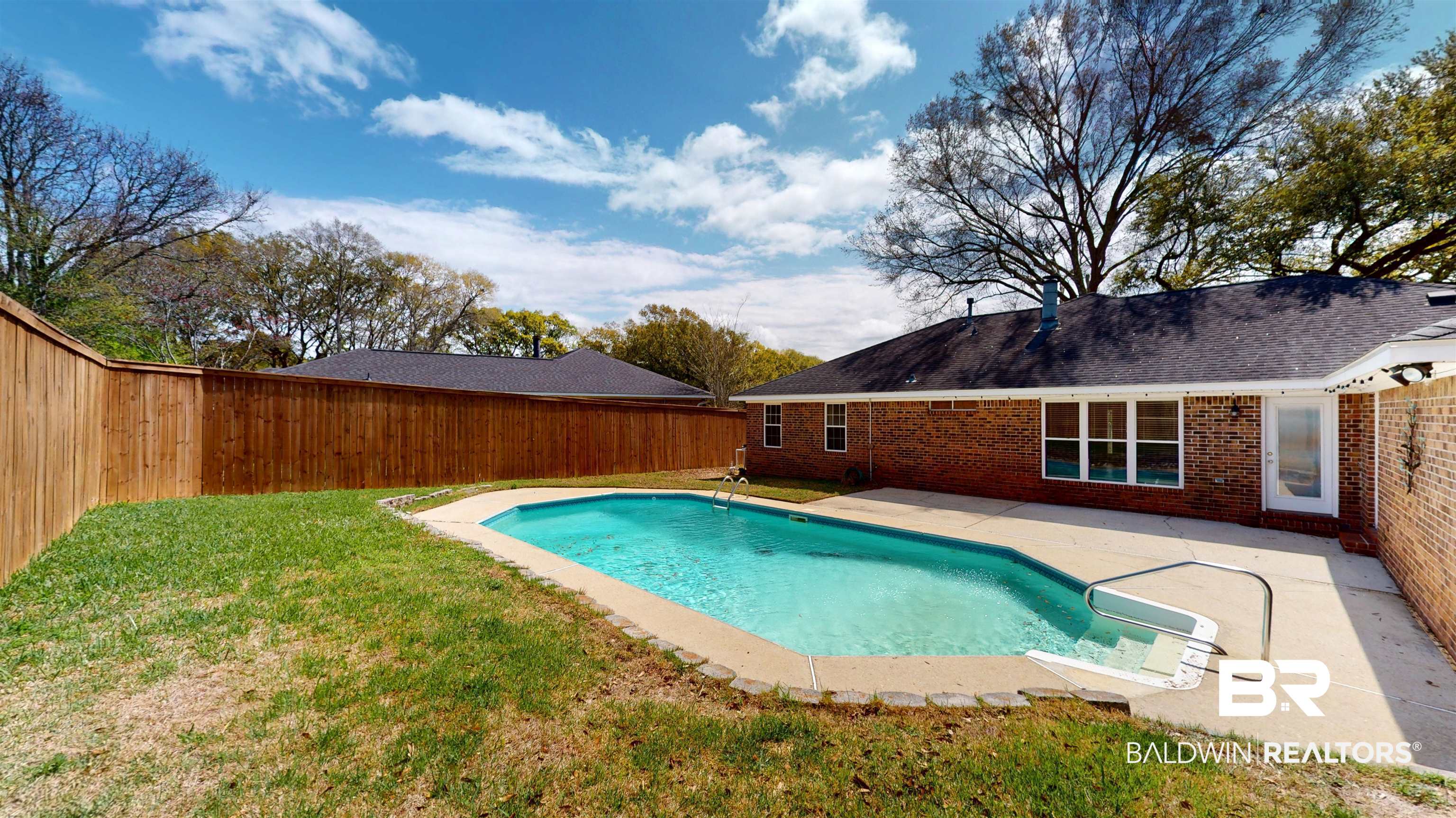 7310 Cheryl Court Mobile, AL 36695 - Photo 13 of 23 An eight-foot privacy fence surrounds the sparkling saltwater pool!