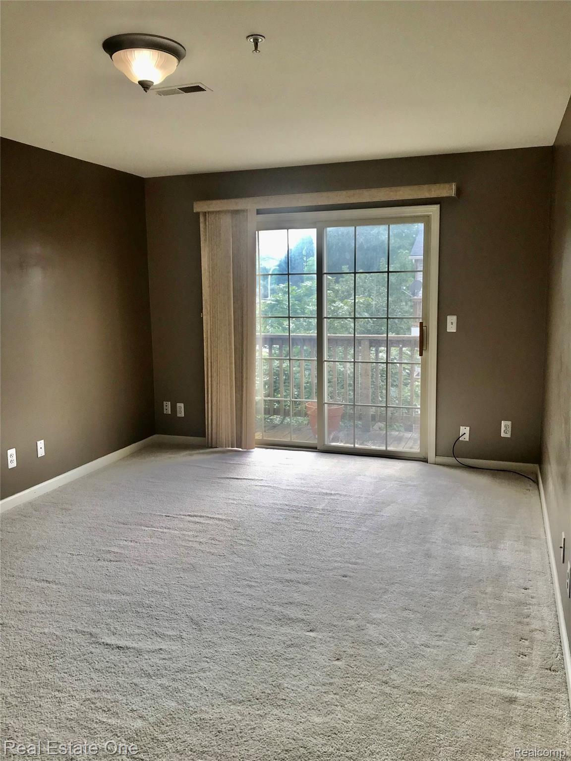 16918 Farmington Road Livonia, MI 48154 - Photo 12 of 21 BEDROOM WITH DOORWALL LEADING TO BALCON