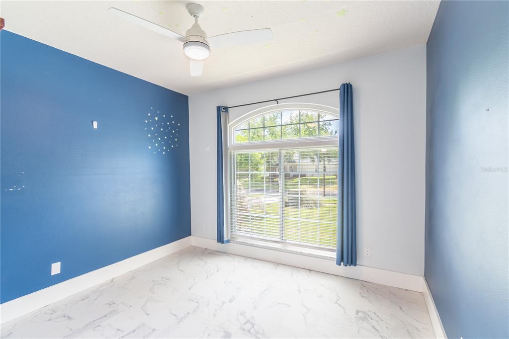 3862 Beacon Ridge Way Clermont, FL 34711 - Photo 35 of 56 a view of an empty room with a window