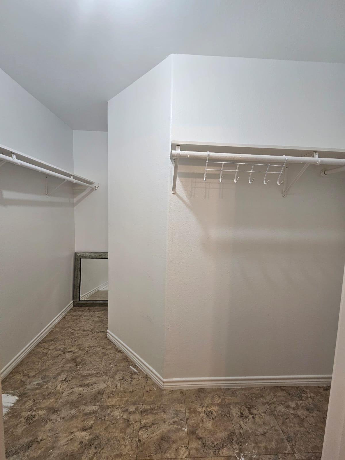 606 Trinity Street Lockhart, TX 78644 - Photo 16 of 23 Ample storage solutions define this practical walk-in closet, ready for personalized organization.