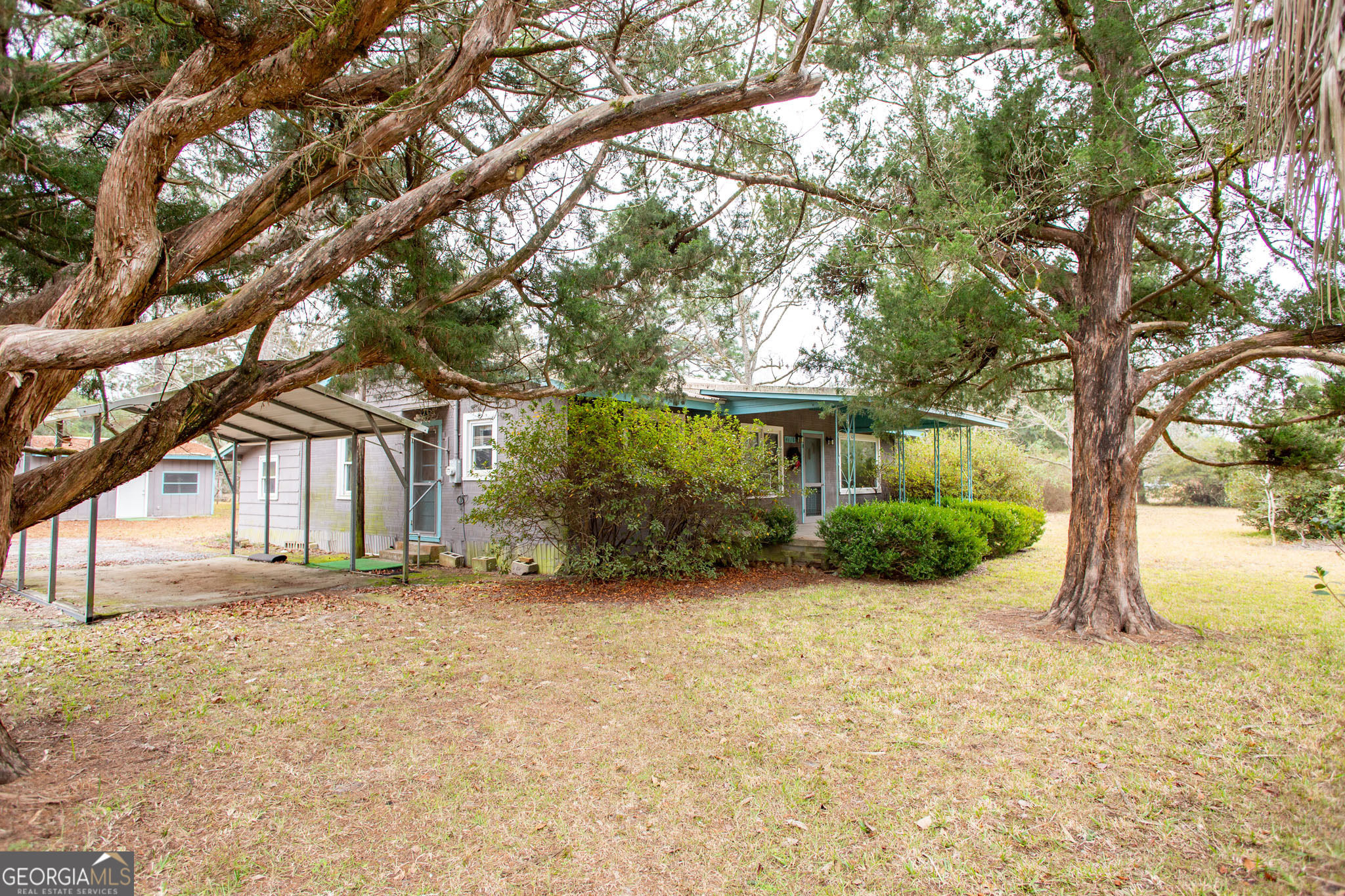 4618 Old Waltertown Road Waycross, GA 31503 - Photo 3 of 39 a view of a house with a yard and tree