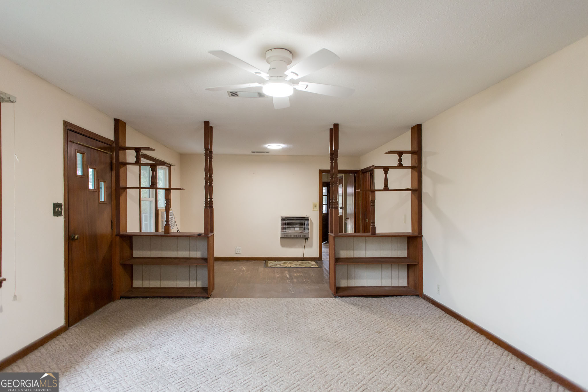 4618 Old Waltertown Road Waycross, GA 31503 - Photo 10 of 39 wooden floor in an empty room with a kitchen