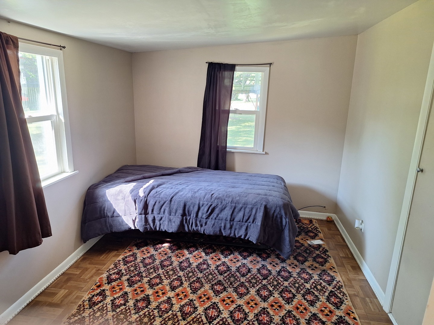 931 South Cedar Road New Lenox, IL 60451 - Photo 14 of 16 a bed sitting in a bedroom next to a window