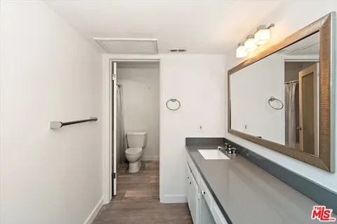 a bathroom with a toilet and a sink