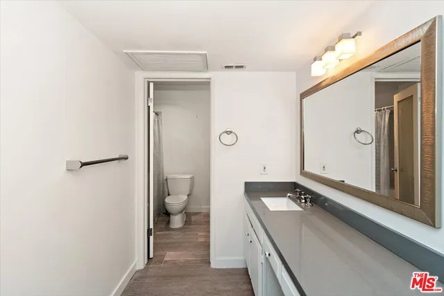 a bathroom with a toilet and a sink