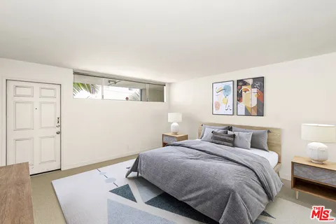 an empty room with sliding glass door